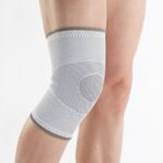 Timago kelio įtvaras, palaikantis lengvą kompresiją