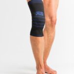 Kompresinis kelio įtvaras su girnelės stabilizavimu ir silikoniniu žiedu